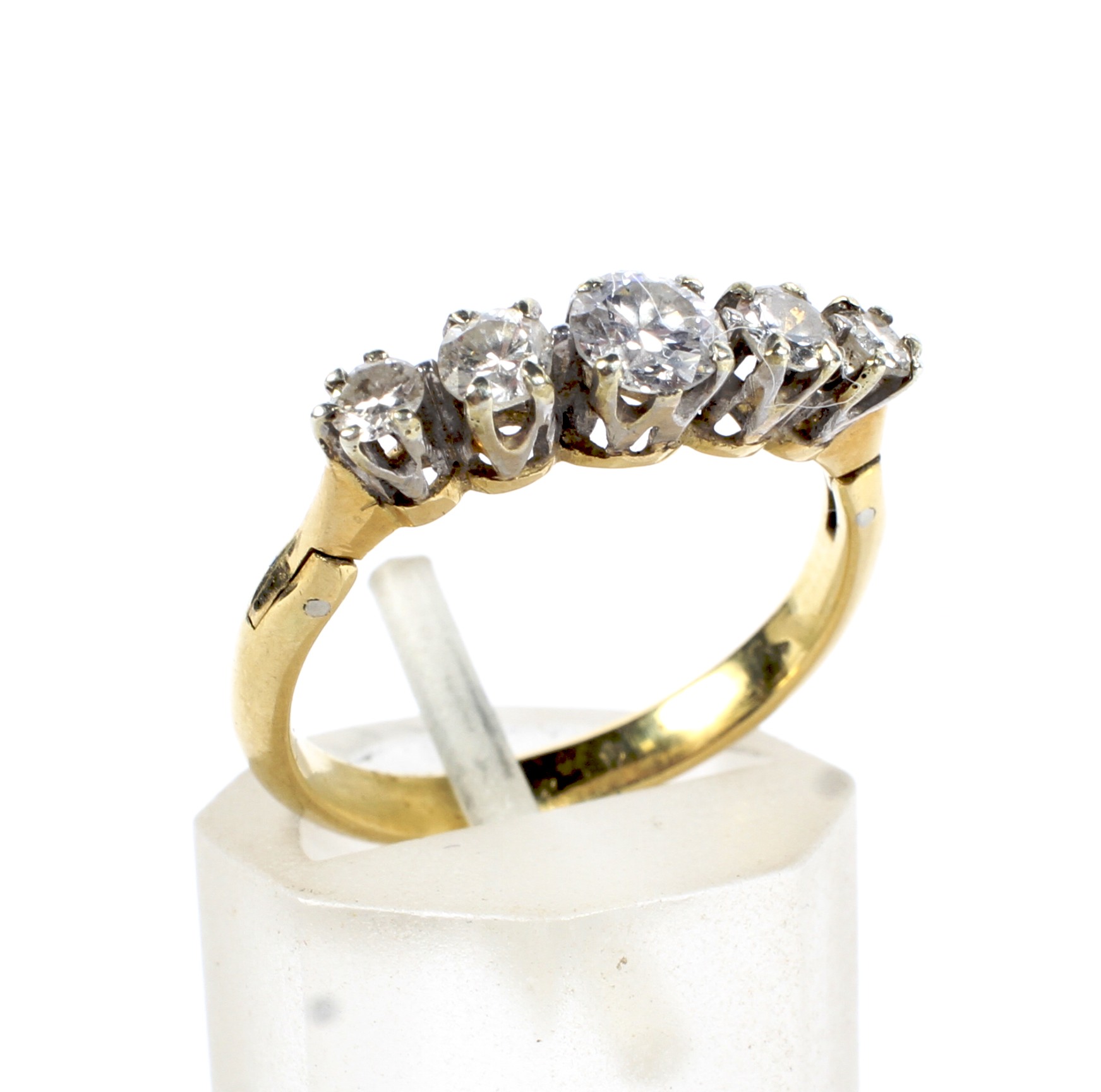 A vintage gold and diamond five stone ring. The graduated early modern-round-brilliants approx. 0.
