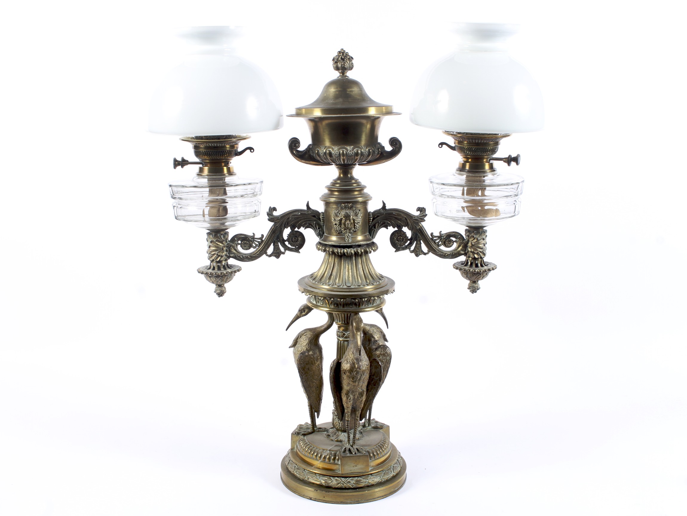 A Victorian brass and gilt-metal mounted twin light oil lamp.