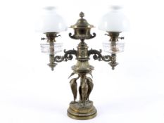 A Victorian brass and gilt-metal mounted twin light oil lamp.