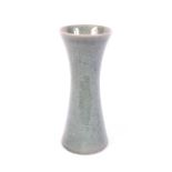 A Chinese celadon crackle glazed waisted cylindrical vase.