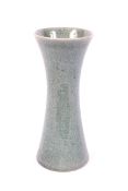 A Chinese celadon crackle glazed waisted cylindrical vase.