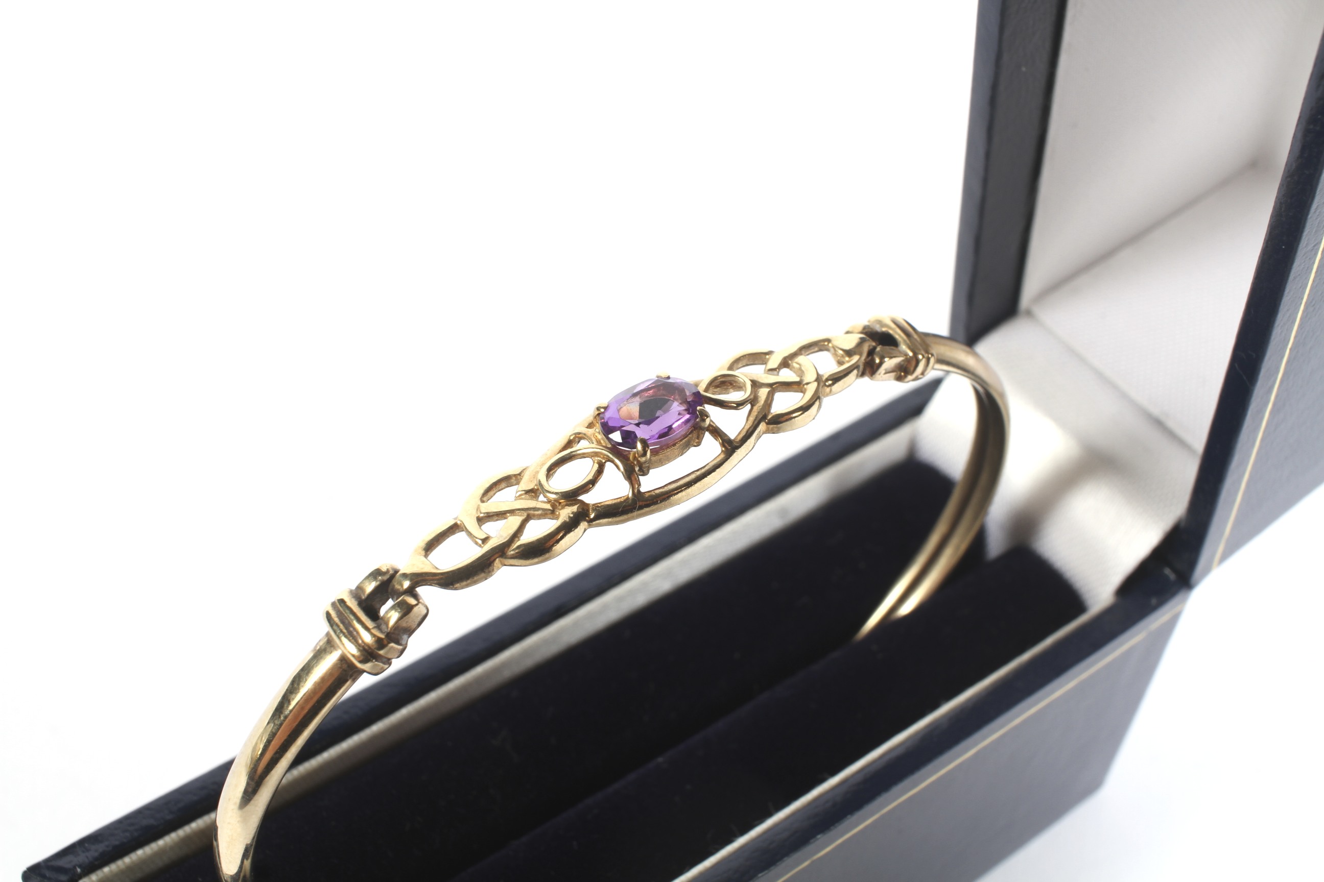 A modern 9ct gold and amethyst single stone bangle. - Image 3 of 3