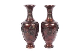 A pair of Asian Japanese Meiji-style patinated bronze vases, 20th century.
