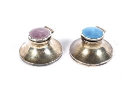 Two silver capstan-shaped and guilloche enamelled inkwells.