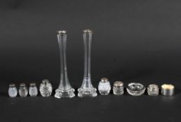 A group of silver and white metal-topped glass jars, vases and other items, 19th century and later.