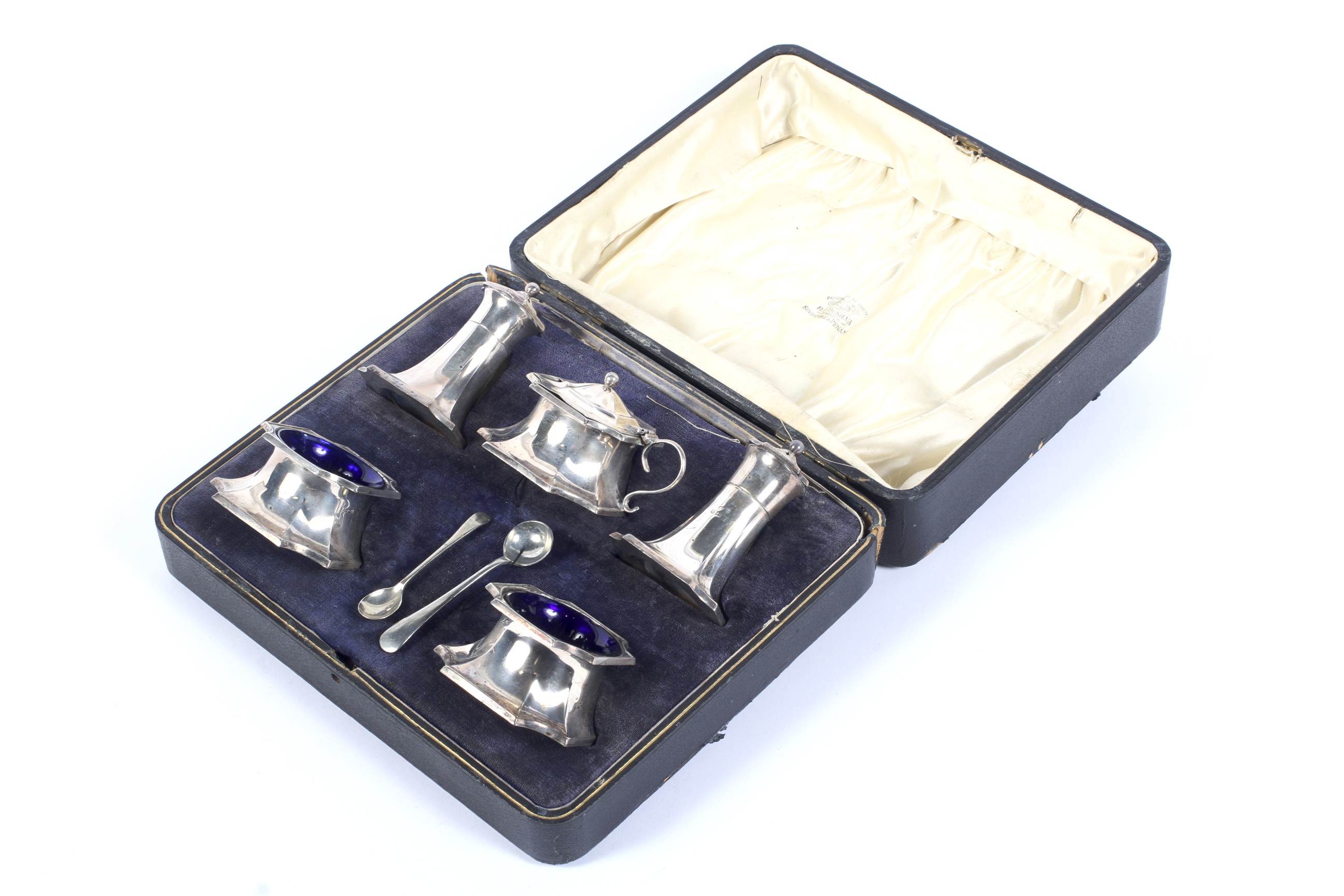 A silver five piece cruet set, in a case.