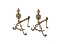 A pair of late 19th century brass firedogs.