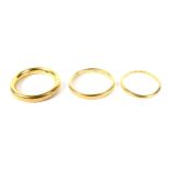 Three Victorian and later 22ct gold wedding bands. Comprising: a court shaped band, 3.