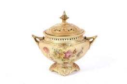 A late 19th century Royal Worcester blush ivory ground two-handled pot-pourri vase and cover.