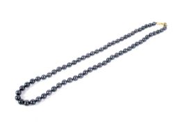 A South Sea cultured pearl necklace. The 66 black-stained beads approx. 6.2 - 6.