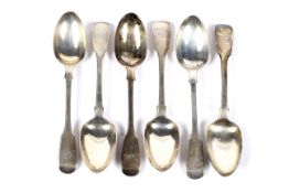 A set of six Victorian silver fiddle pattern dessert spoons with script initials.