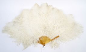 An early 20th century folding ostrich feather fan.