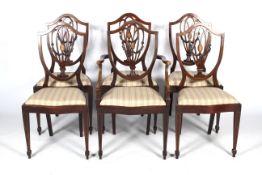 A set of six early 20th century Georgian Hepplewhite style dining chairs.