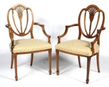 A pair of 20th century Hepplewhite style dining chairs.