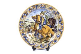 An Italian maiolica 19th century charger in the Castelli style.