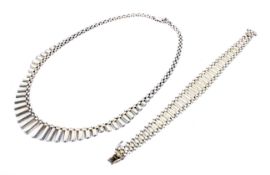 A stylish and vintage Italian satinised and polished silver graduated baton-fringe necklace and a