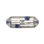 An Art Deco platinum, sapphire and diamond brooch.