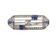 An Art Deco platinum, sapphire and diamond brooch.