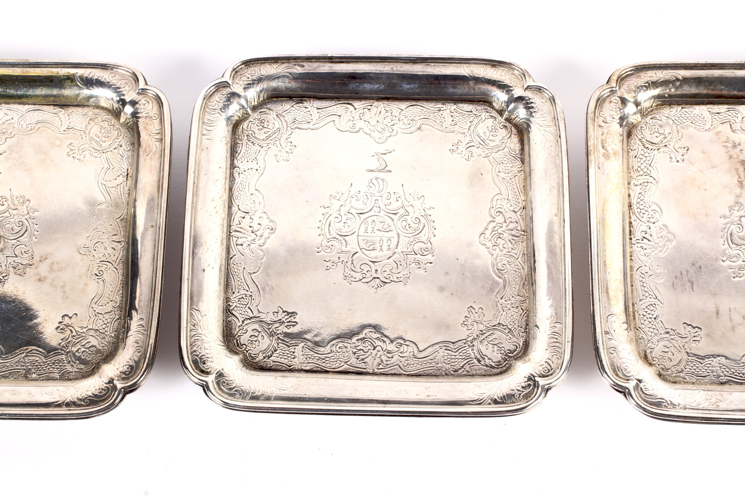 Paul de Lamerie, a matched set of three early George II silver square waiters. - Image 2 of 9