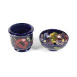 A Moorcroft blue ground Anemone pattern bowl and a planter.