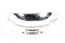A silver hammered oval pedestal bowl.