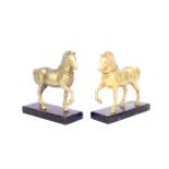 A pair of gilt metal models of horses on wooden bases after the horses of St Mark's Basilica,