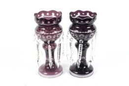 A pair of Late Victorian cut-glass amethyst tinted lustres and pendant drops.