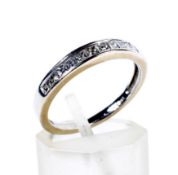A princess diamond half-eternity ring.