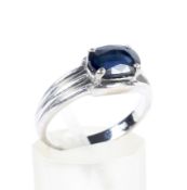 An oval sapphire single stone ring.