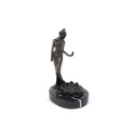 A bronzed Art Nouveau lady mounted on an oval marble base.