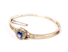 An Edwardian rose gold, sapphire and diamond cluster bangle.