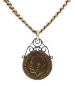 An early 20th century 18ct gold curb link necklace hung with a sovereign.
