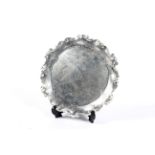 A late Victorian silver shaped-round salver.