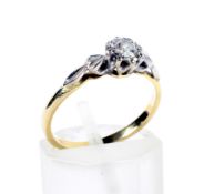 A vintage gold and diamond solitaire ring. The round brilliant approx. 0.
