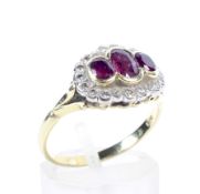A vintage 18ct gold, ruby and diamond shaped-oval dress ring.