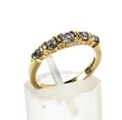 A modern 18ct gold and diamond five stone ring. The graduated old-cut stones approx. 0.