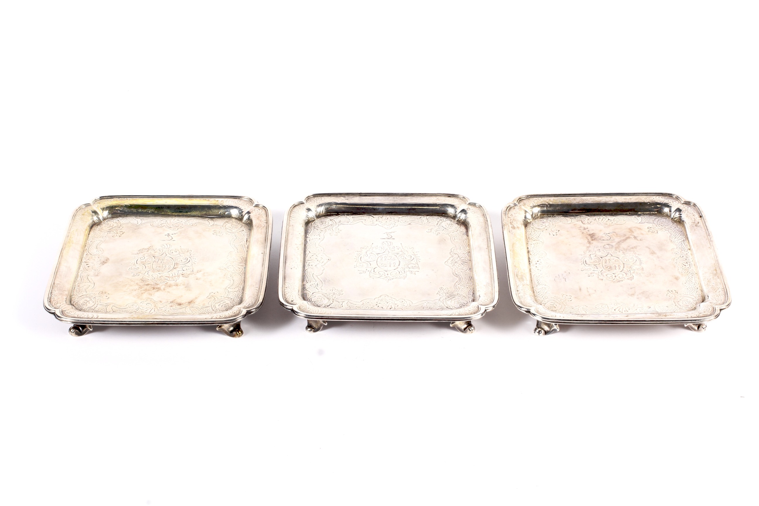 Paul de Lamerie, a matched set of three early George II silver square waiters.