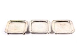 Paul de Lamerie, a matched set of three early George II silver square waiters.