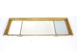 A late 19th/early 20th century Regency-style giltwood overmantel mirror.