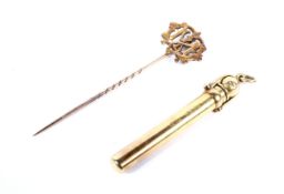 An Edwardian 18ct gold cased propelling pencil and a monogram stick pin.