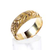 A late Victorian 9ct gold broad wedding band.