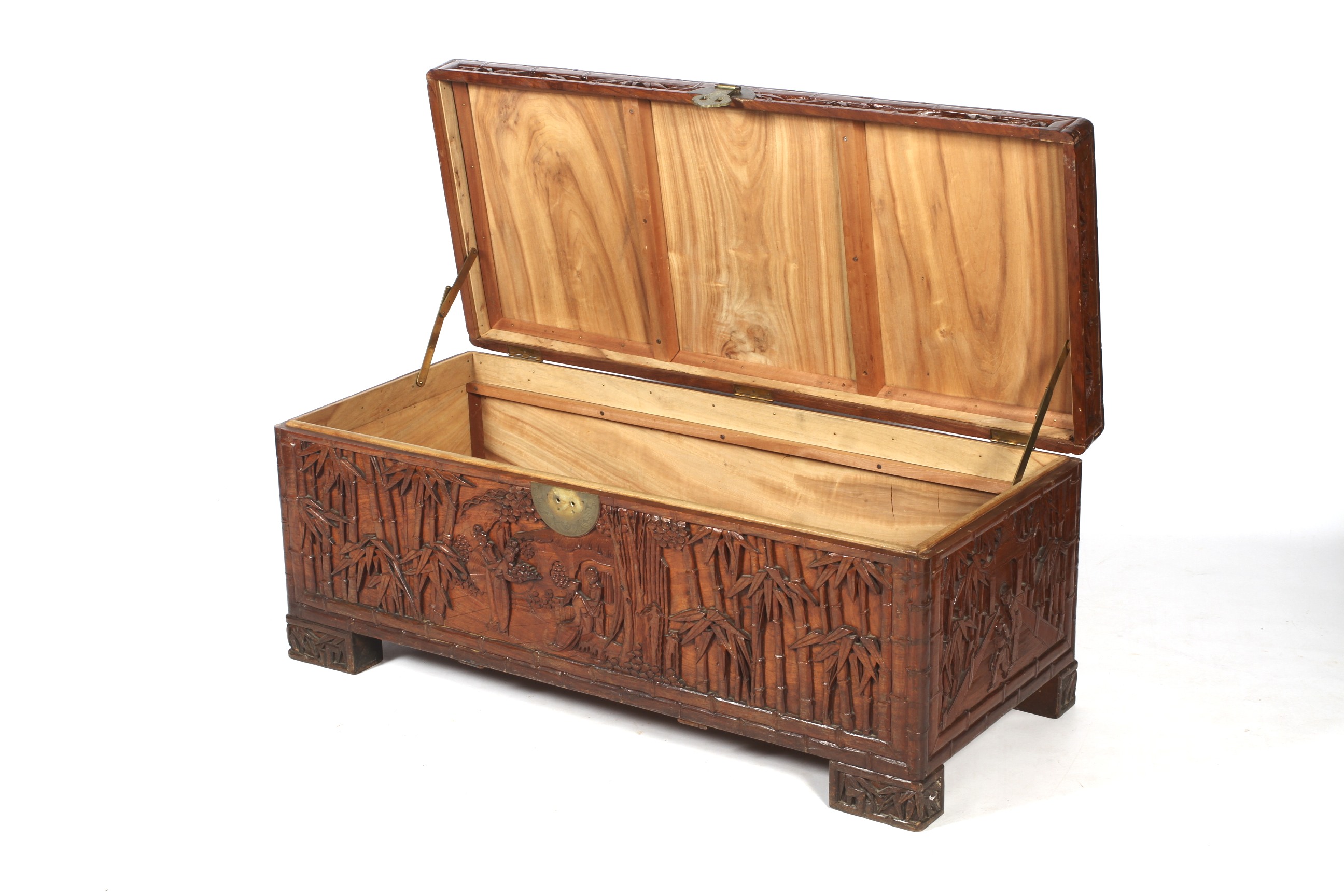 A Chinese carved camphor wood chest. Carved with figures amongst bamboo. - Image 2 of 2