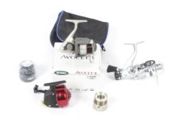 A collection of three freash water fishing reels.