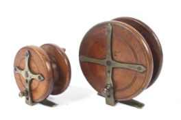 Two wooden 'Nottingham' style reels.