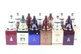 Twelve assorted decanters of Bells Whisky. From 1997 to 2004, all boxed, 70cl, 40% vol.