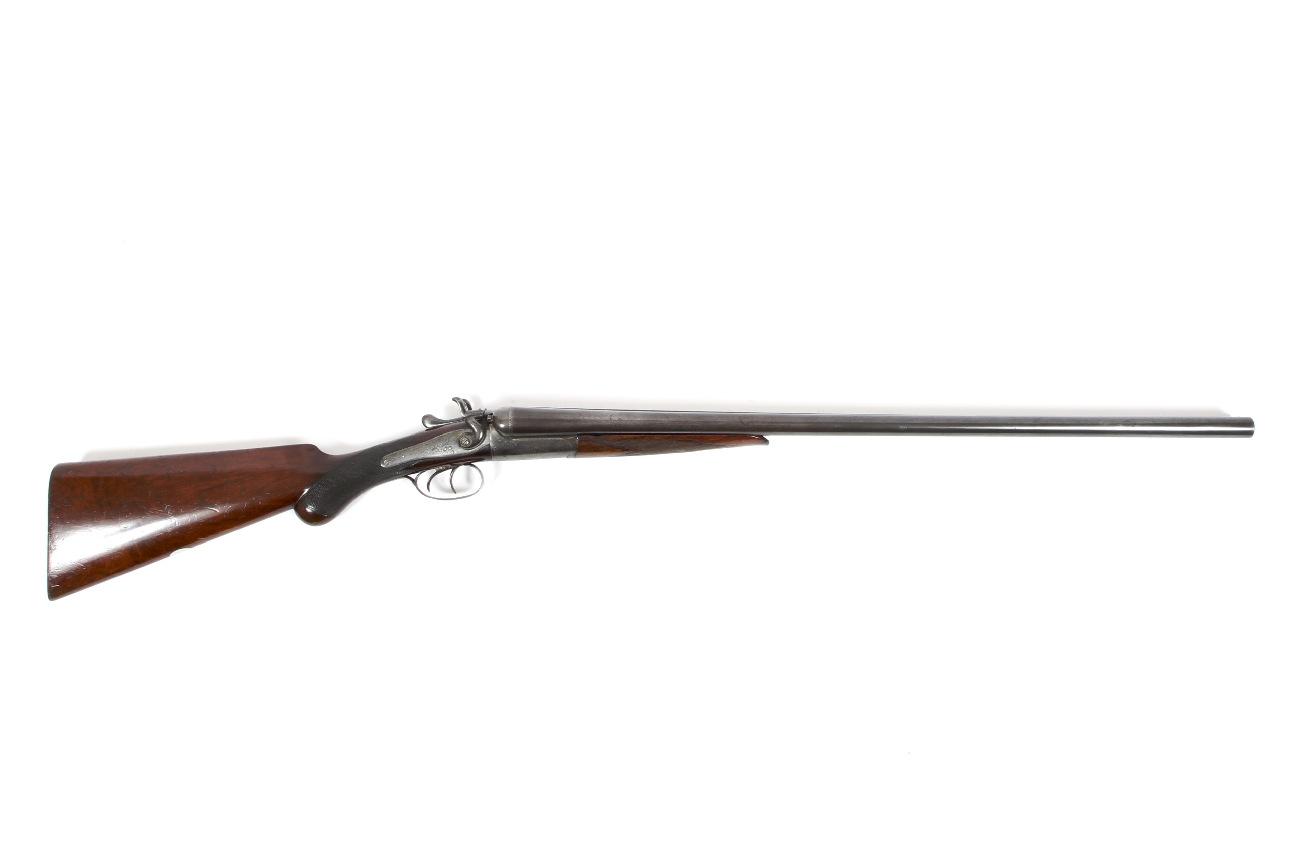 A Page wood 12 gauge hammer gun, side by side shotgun.