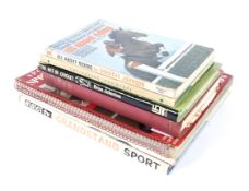 A collection of seven sporting related books.