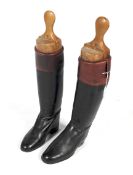 Pair of black leather boots with mahogany top, with trees. H65cm.