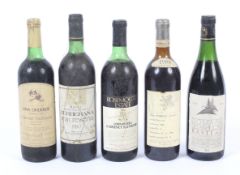 Five bottles of assorted wine from the 1980s.