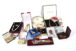 Twenty-five boxes containing assorted costume jewellery. Including necklaces, pendants, etc.